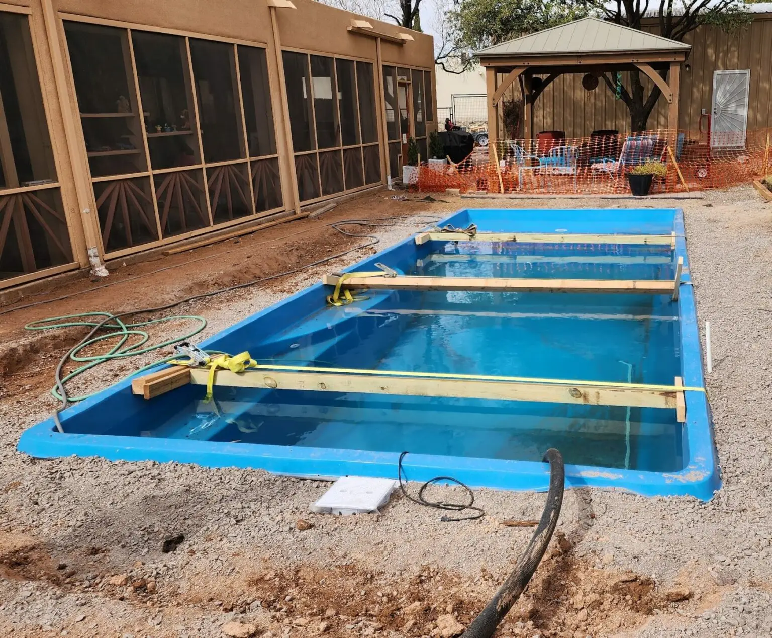 Black Rock Fiberglass pool building in progress. The pool is on mid-early stages of construction.