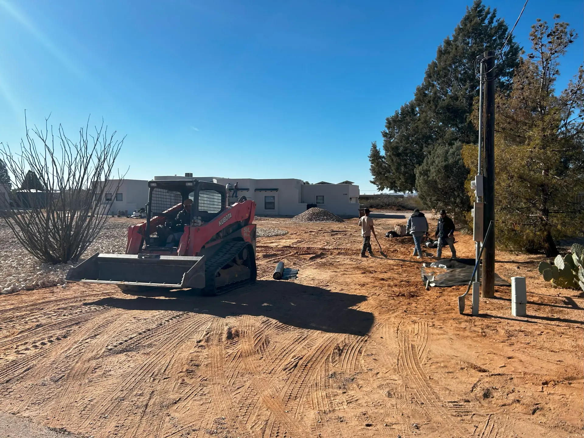 Black Rock Development construction team working on the front yard of a house.